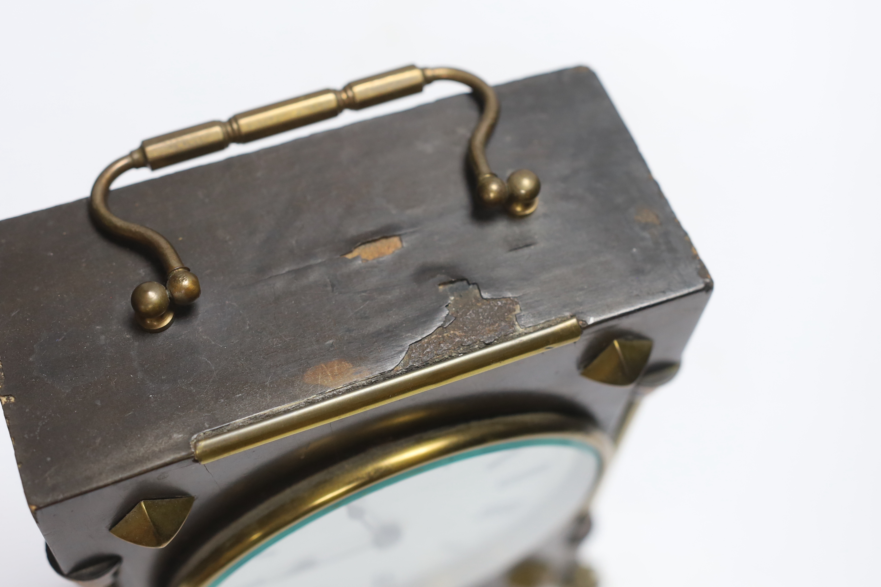 A small late 19th century ebonised mantel timepiece with studded case, 26cm